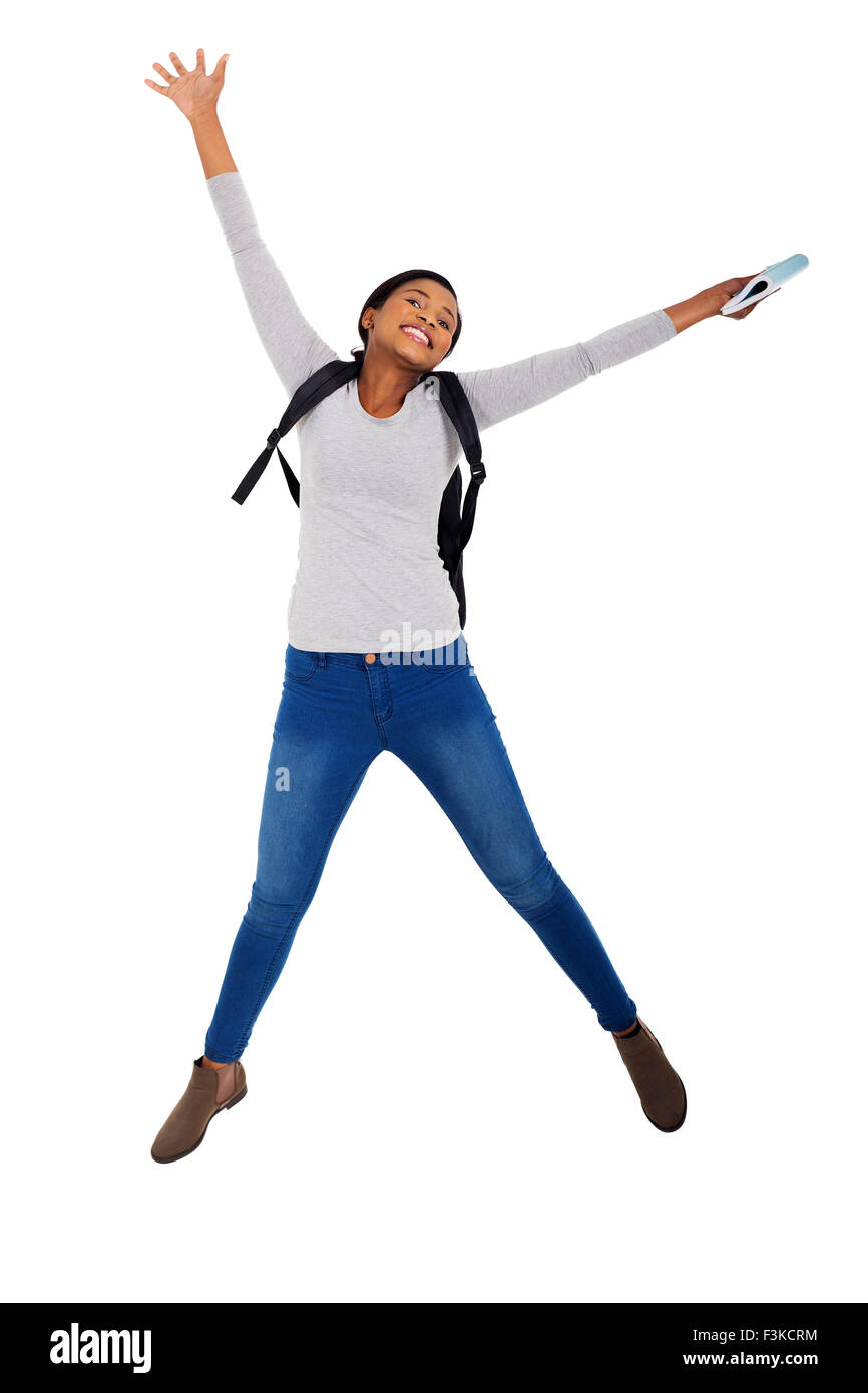 energetic African college student jumping for joy Stock Photo