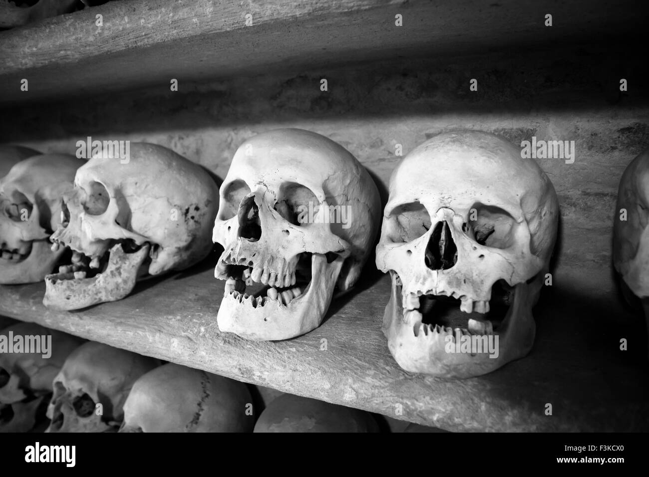 human skulls inside a Christian catacomb in Italy Stock Photo