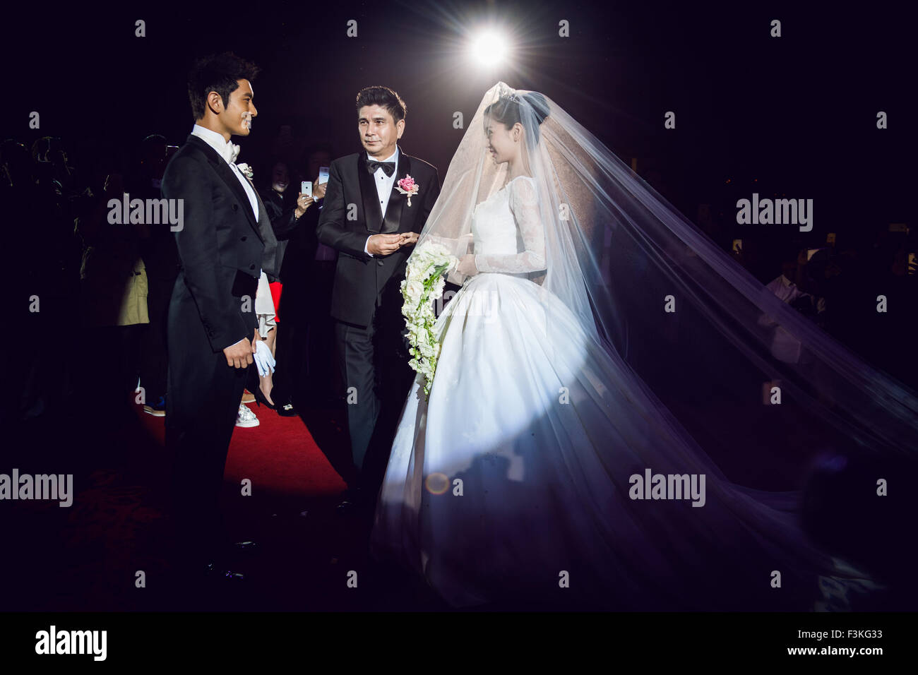Shanghai. 9th Oct, 2015. Actor Huang Xiaoming (L) looks at actress Angelababy during their wedding in Shanghai, east China, Oct. 8, 2015. © Xinhua/Alamy Live News Stock Photo