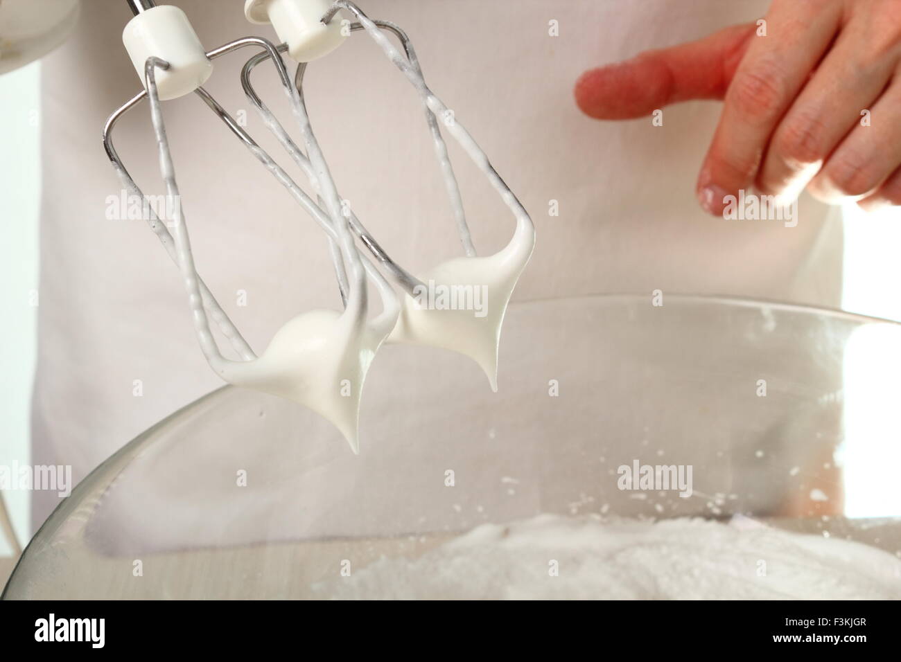 Whisking egg whites and granulated sugar. Making Chocolate Hazelnut