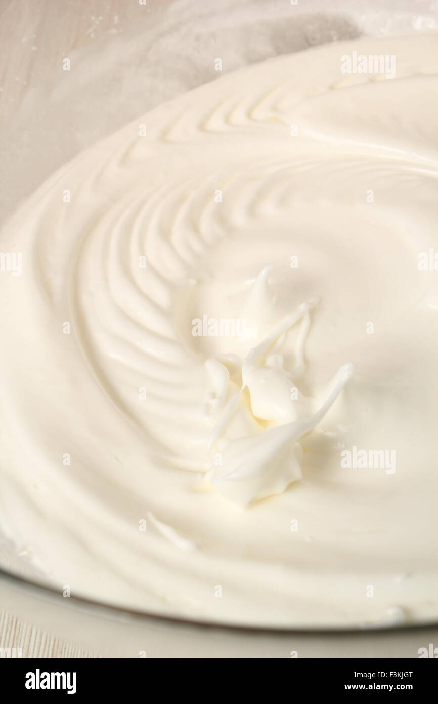 Whisking egg whites and granulated sugar. Making Chocolate Hazelnut