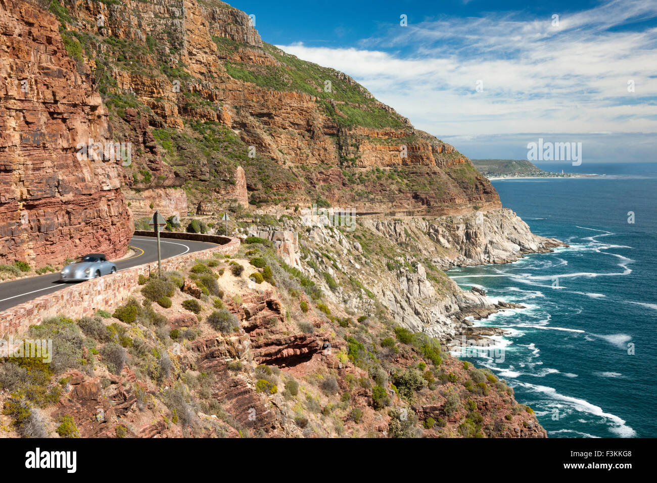 A car on Chapman's Peak Drive along the Atlantic Seaboard, Cape Town, South Africa Stock Photo