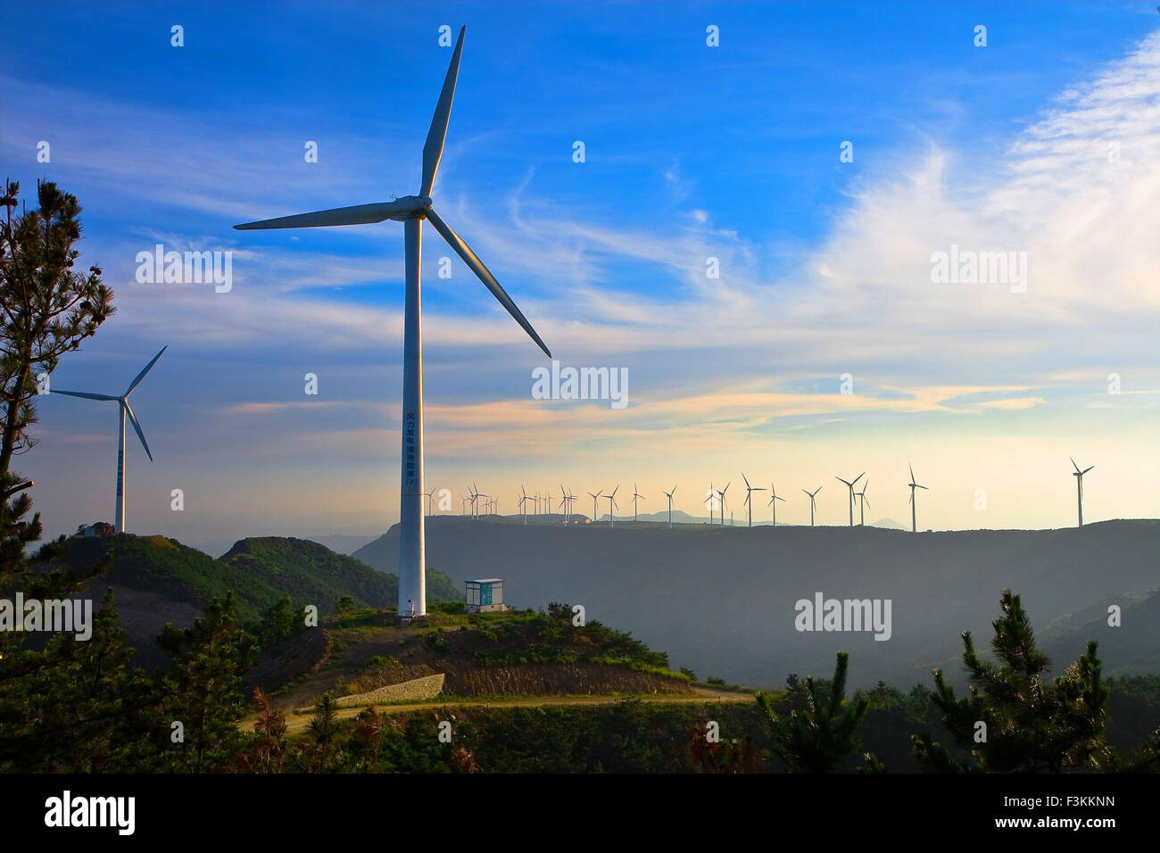 Yantai. 8th Oct, 2015. Photo taken on Oct. 8, 2015 shows the wind turbines at the Tangshan wind power plant in Qixia City, east China's Shandong Province. The provincial wind power generating capacity reached 259 million kwh during the National Day holidays. © Ren Mengxue/Xinhua/Alamy Live News Stock Photo