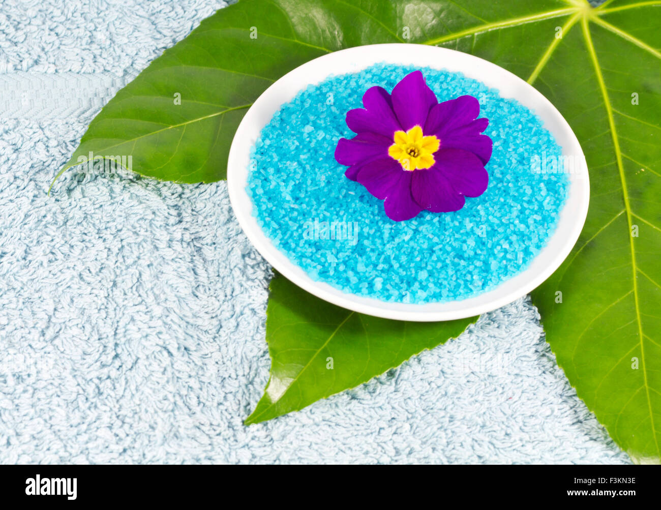 Azure bath salt with flower at spa Stock Photo - Alamy