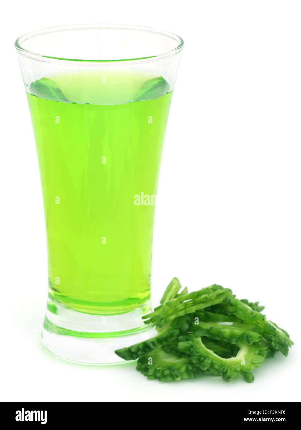 Herbal juice of green momodica over white background Stock Photo
