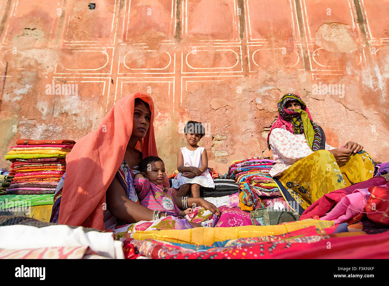 Colourful clothes and saree selling by street vendor during sunday market in Jaipur, India. Stock Photo