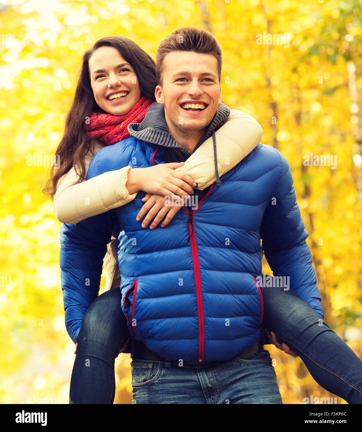 smiling friends having fun in autumn park Stock Photo - Alamy
