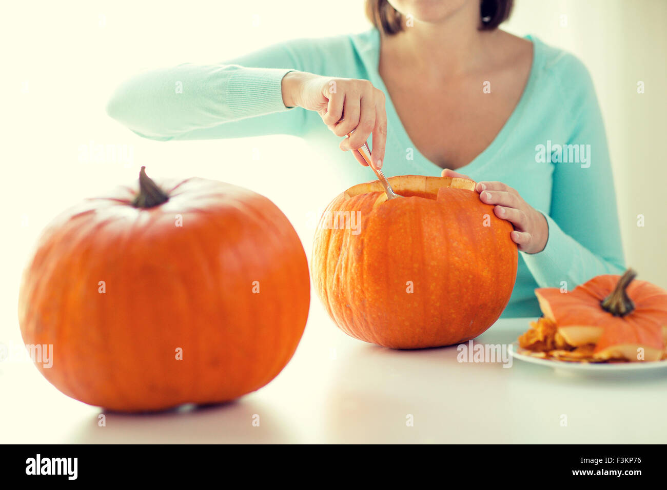 close up of woman with pumpkins at home Stock Photo