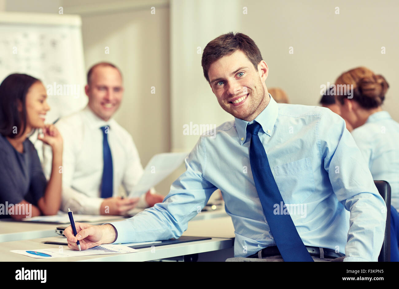 group of smiling businesspeople meeting in office Stock Photo - Alamy