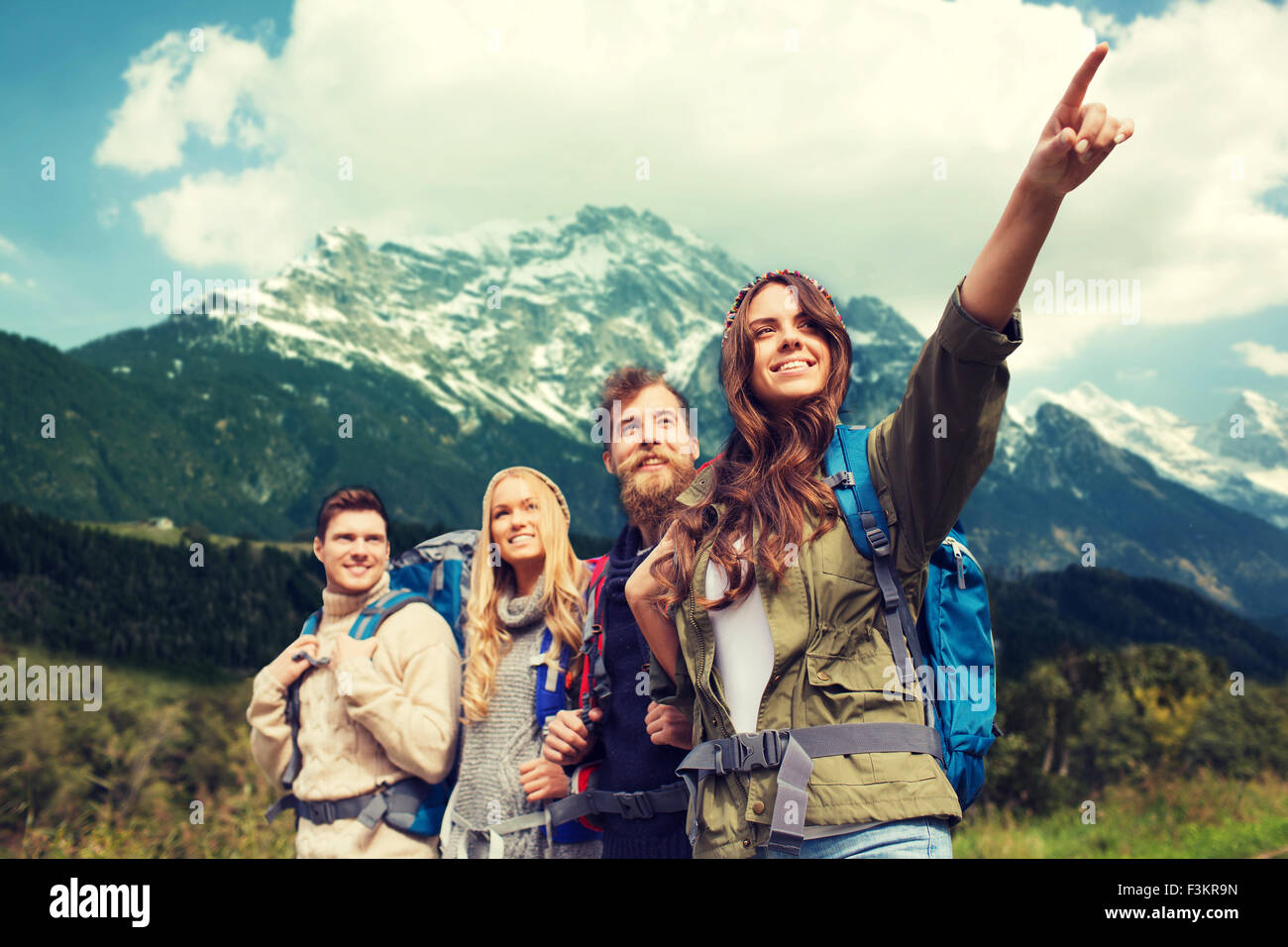 group of smiling friends with backpacks hiking Stock Photo - Alamy