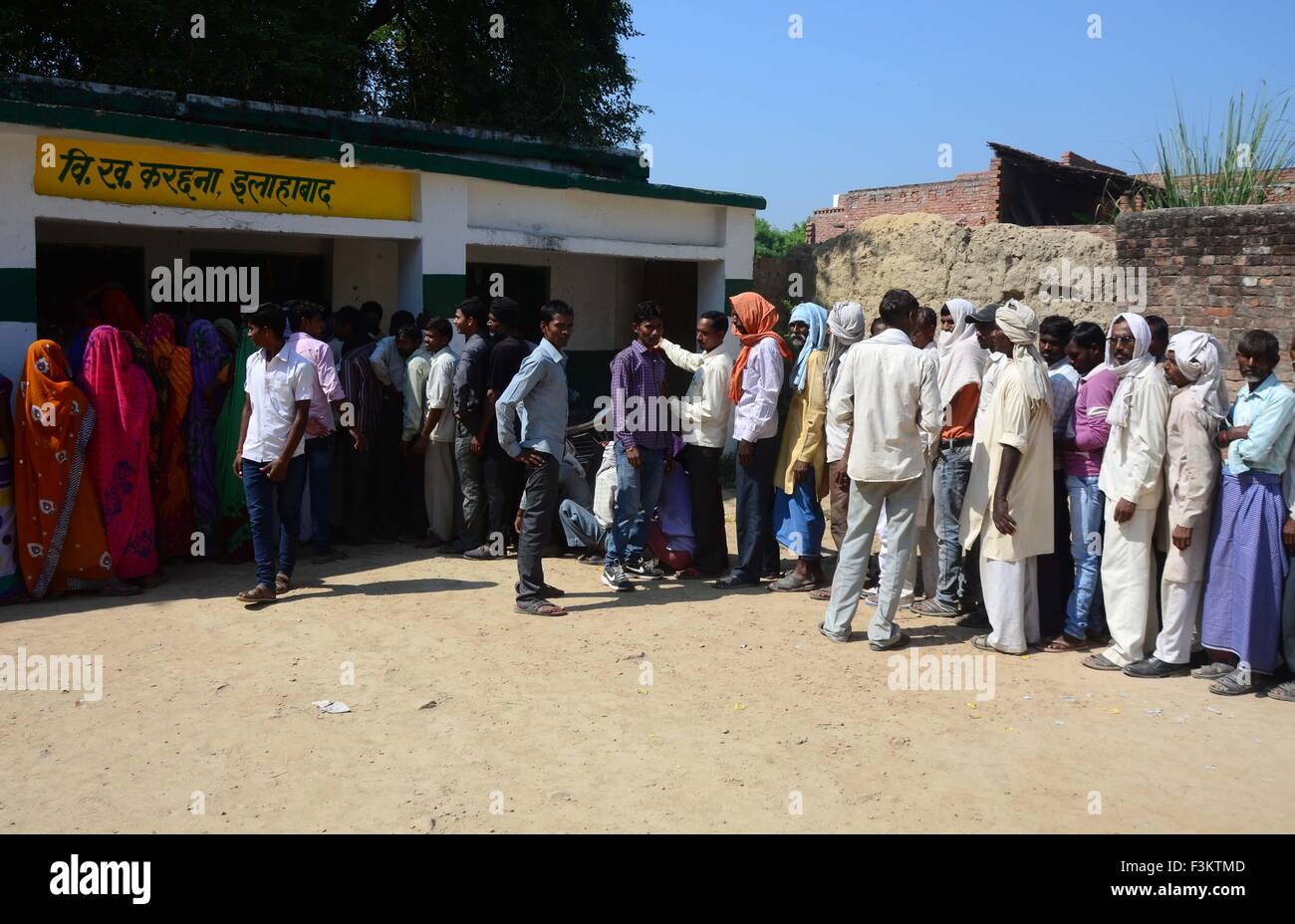 Allahabad, India. 09th Oct, 2015. People in a queue to cast their vote ...