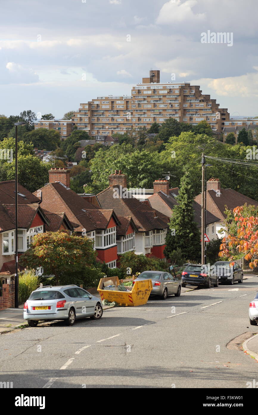 Suburban street in South East London showing the famous Dawson Heights 1960's housing scheme in the background Stock Photo