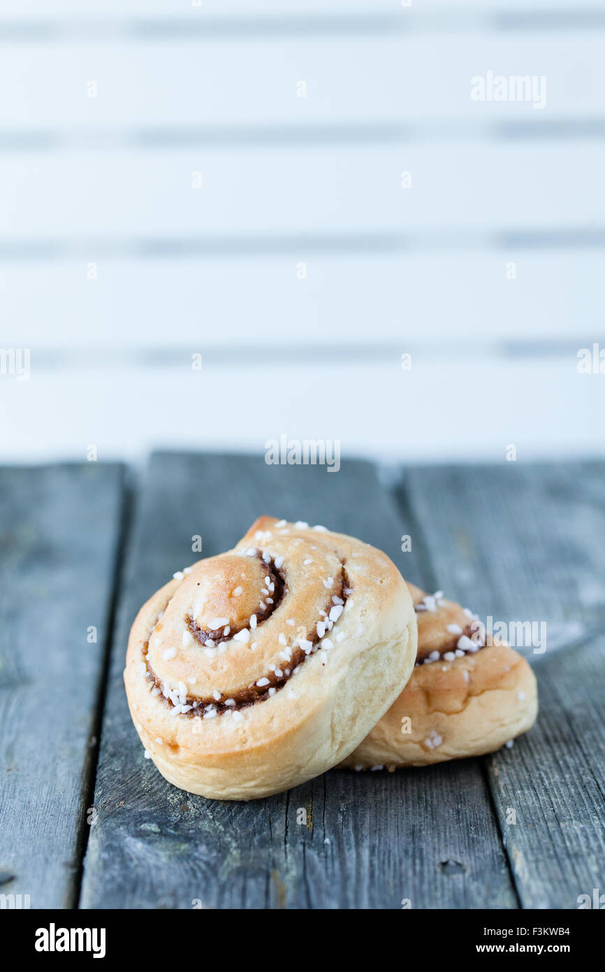 cinnamon buns on dark wooden background Stock Photo