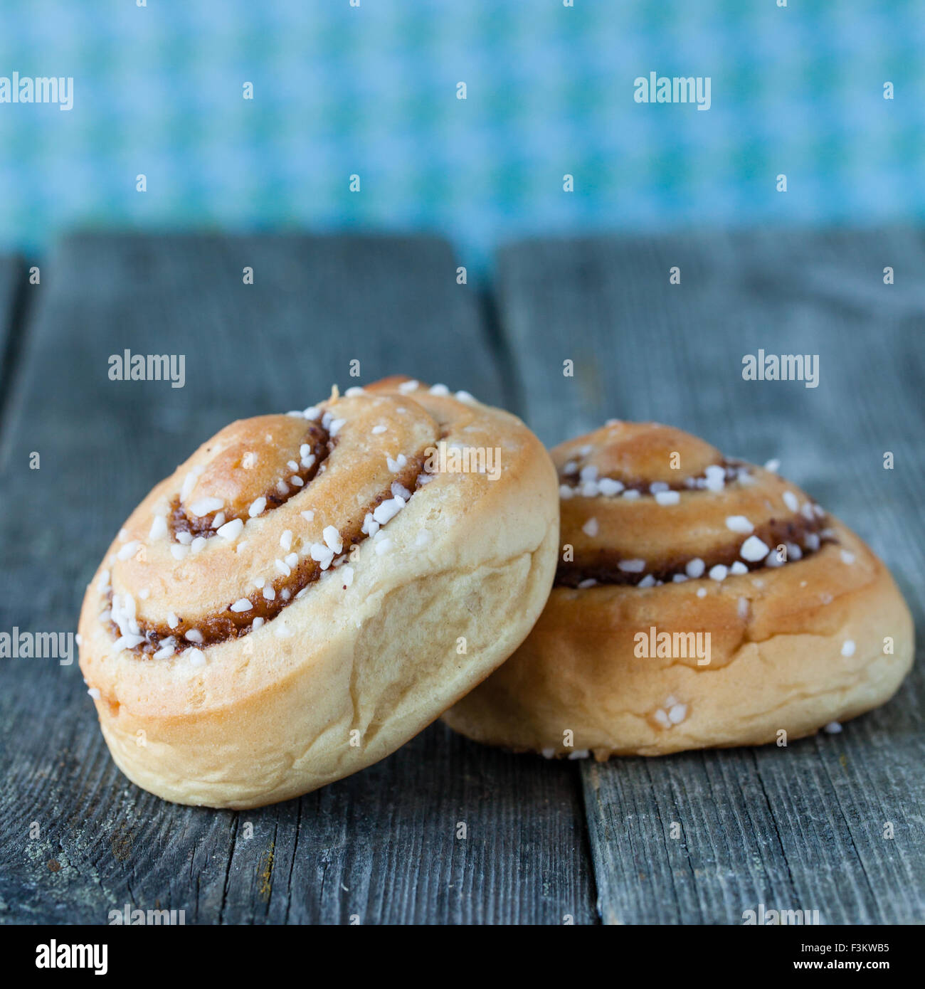 cinnamon buns on dark wooden background Stock Photo