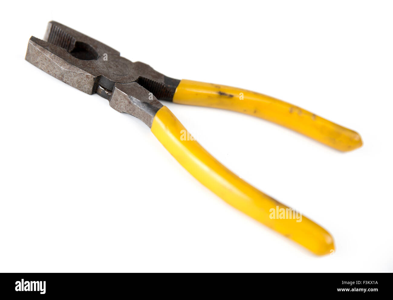 Closeup of rusted metal pliers isolated against white Stock Photo