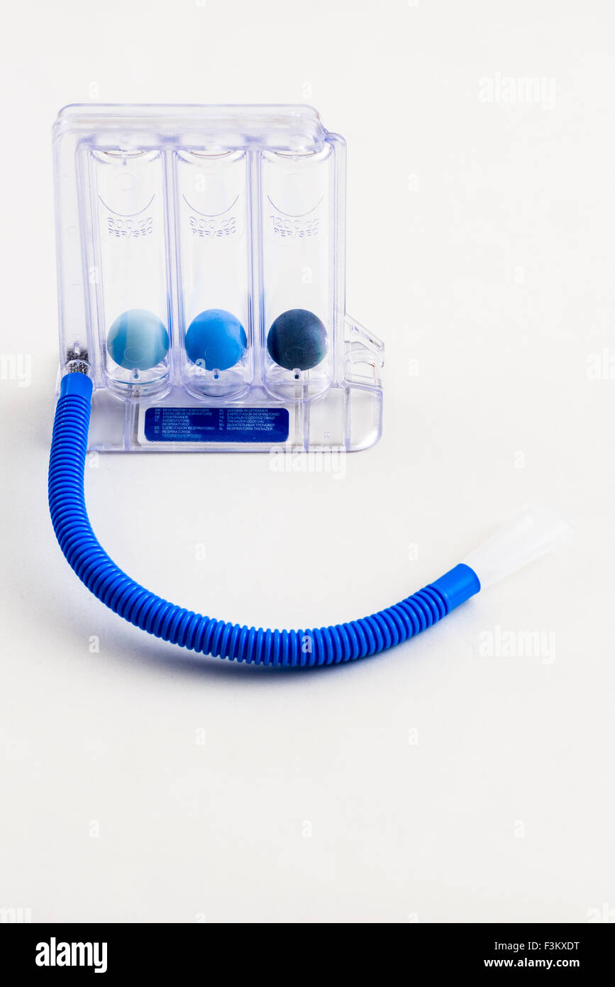 A respiratory exerciser for medical use, displayed on a white table Stock Photo