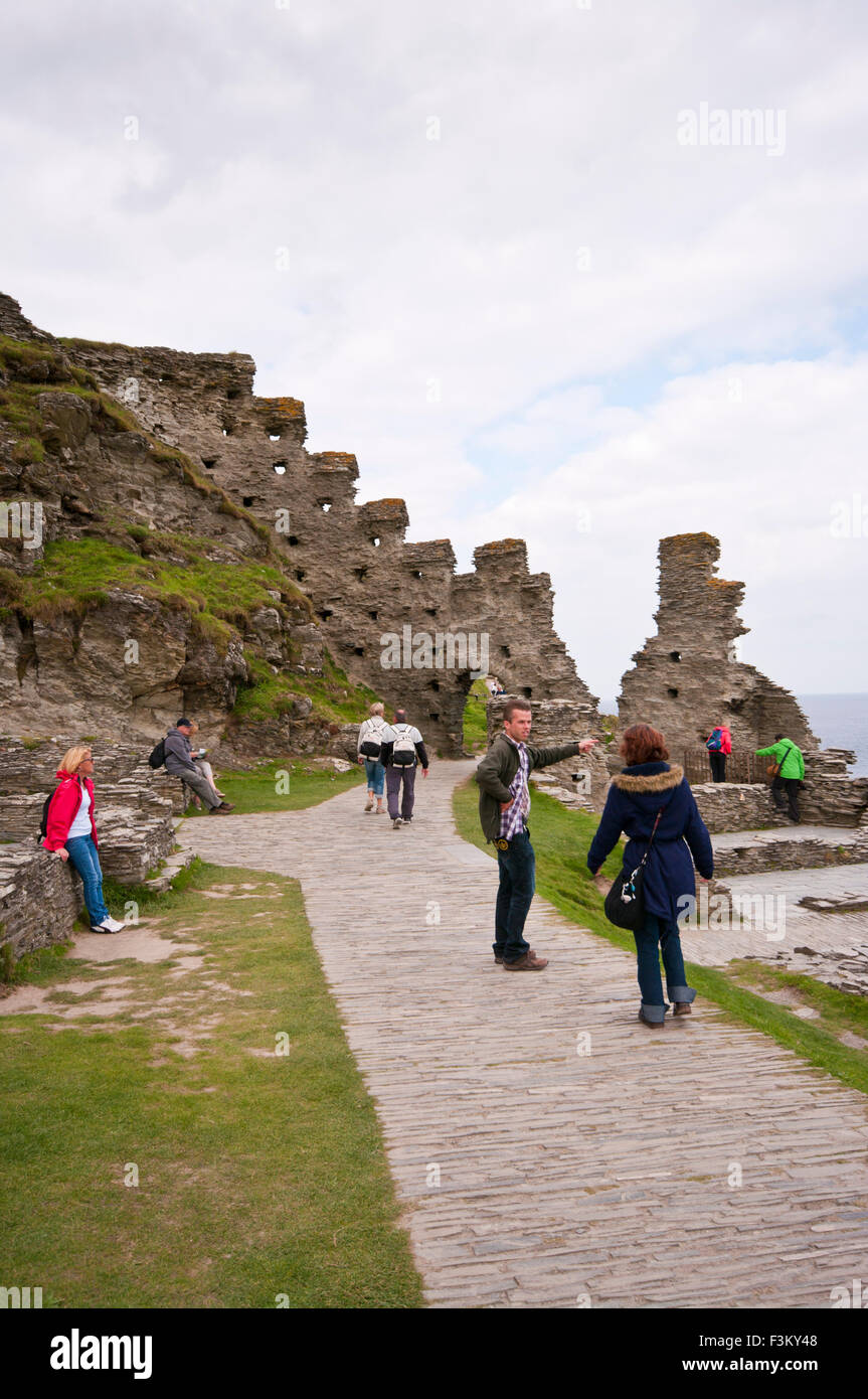 Tourists Among The Ruins Of Tintagel castle Cornwall England UK Stock Photo