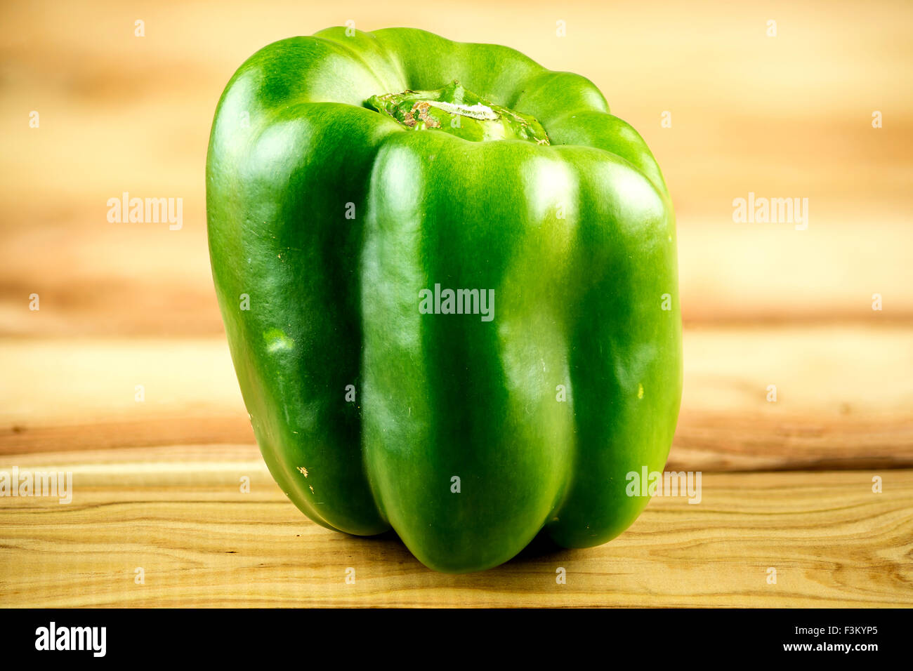 Spicy green bell pepper on board Stock Photo - Alamy