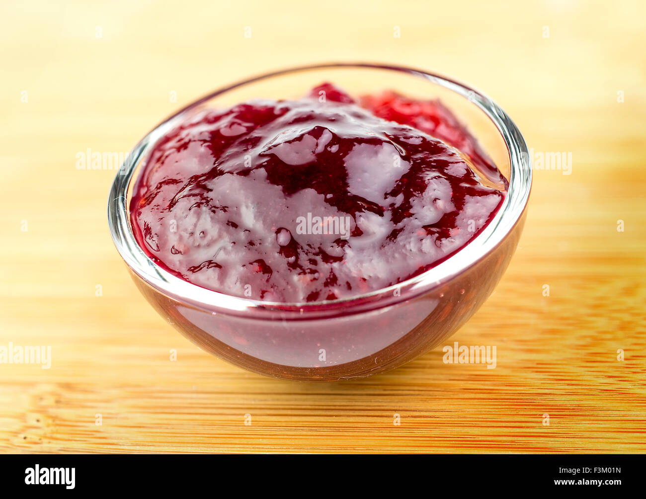 Tasty red raspberry jam in a bowl Stock Photo