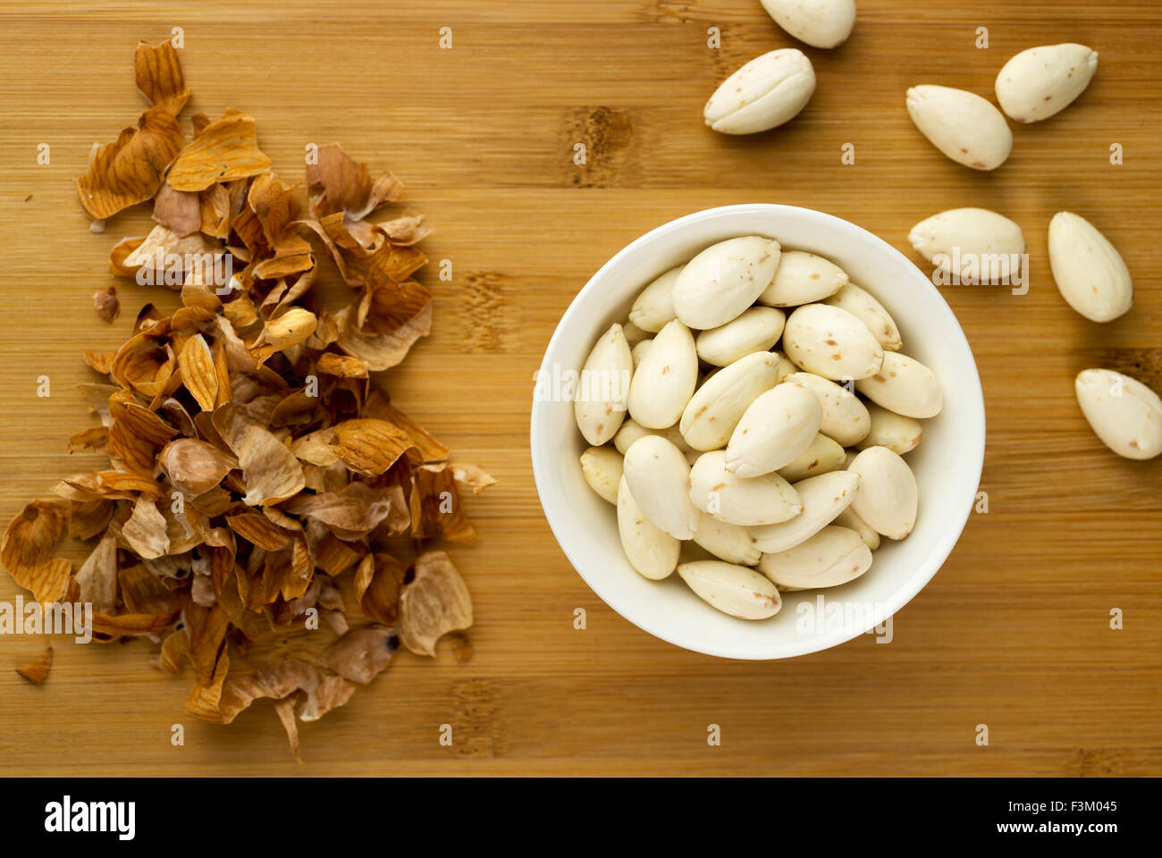 Bowl of almonds that have been soaked in water then skinned. Pile of