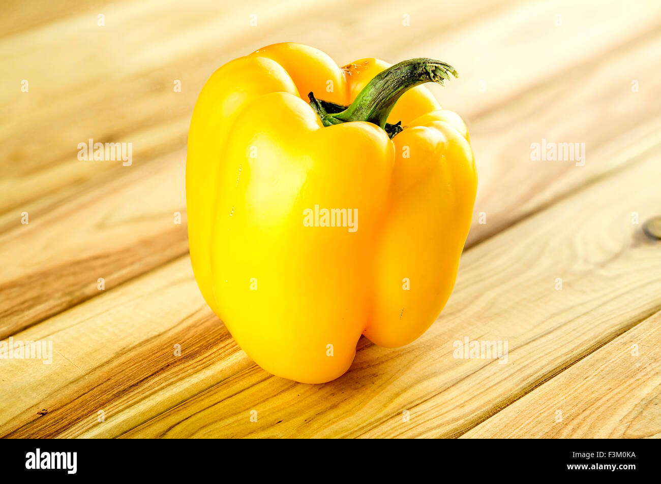 Yellow pepper on chopping block Stock Photo Alamy