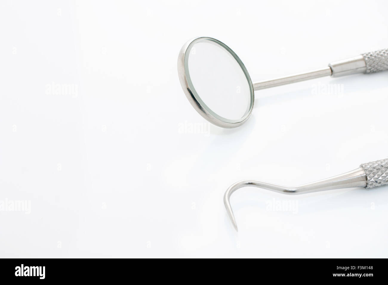 Periodontal probe and dental mirror with copy space Stock Photo Alamy