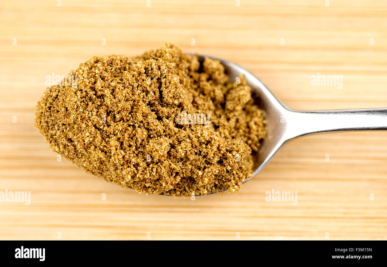 Crushed cumin powder in teaspoon Stock Photo