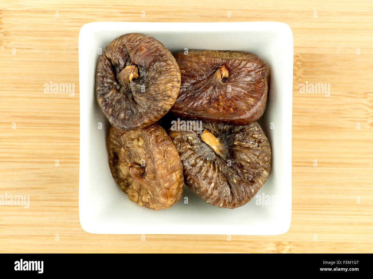 Dried figs in white bowl Stock Photo Alamy