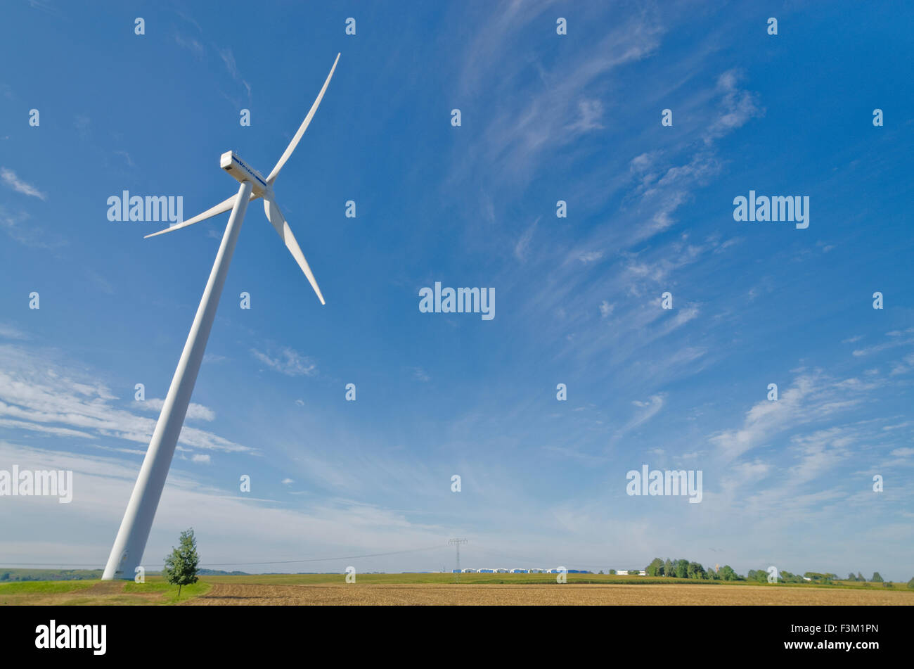A wind power plant in agricultural landscape with blue sky Stock Photo ...