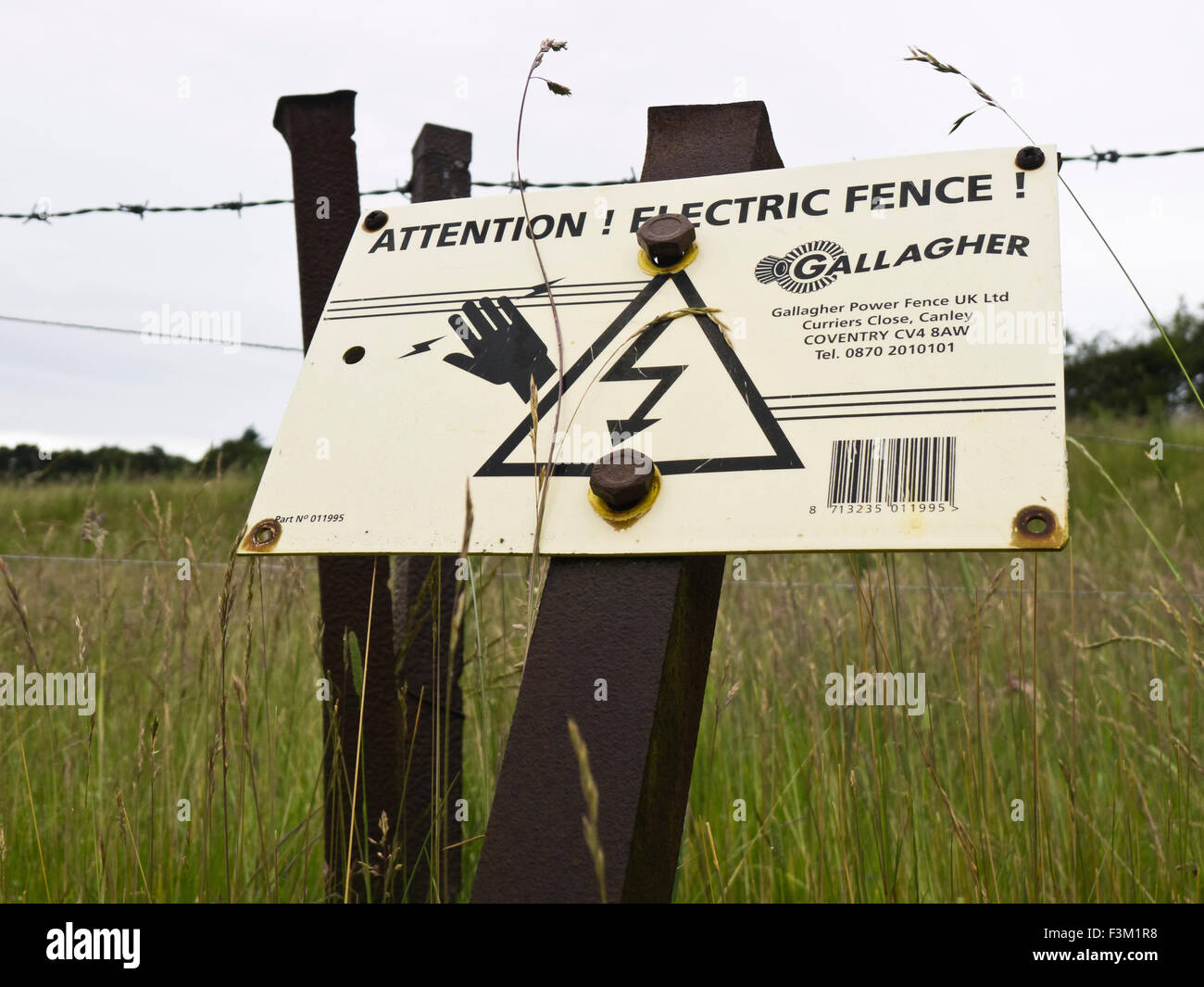 Warning sign for an electric fence. Stock Photo