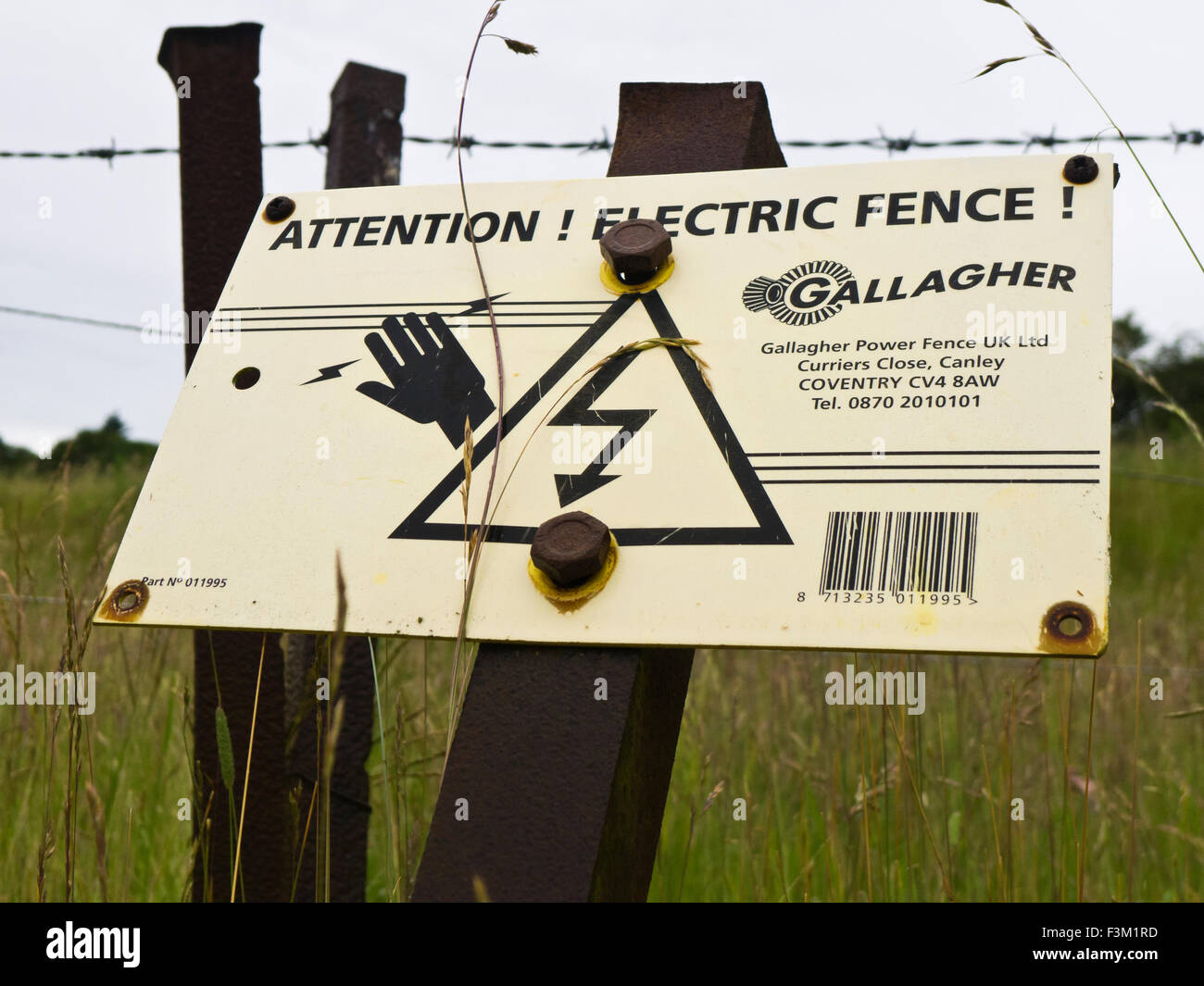 Warning sign for an electric fence. Stock Photo