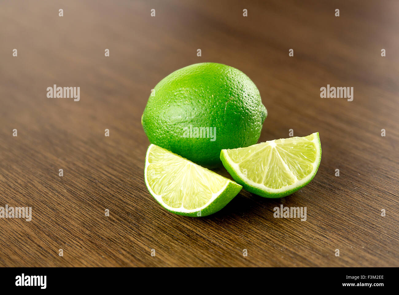 Limes on rustic background with copy space Stock Photo