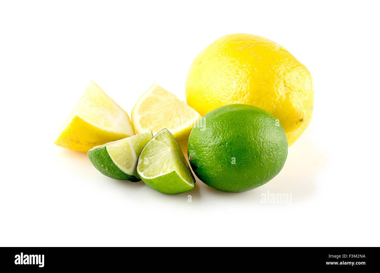 Diced lemons and limes, isolated against white Stock Photo