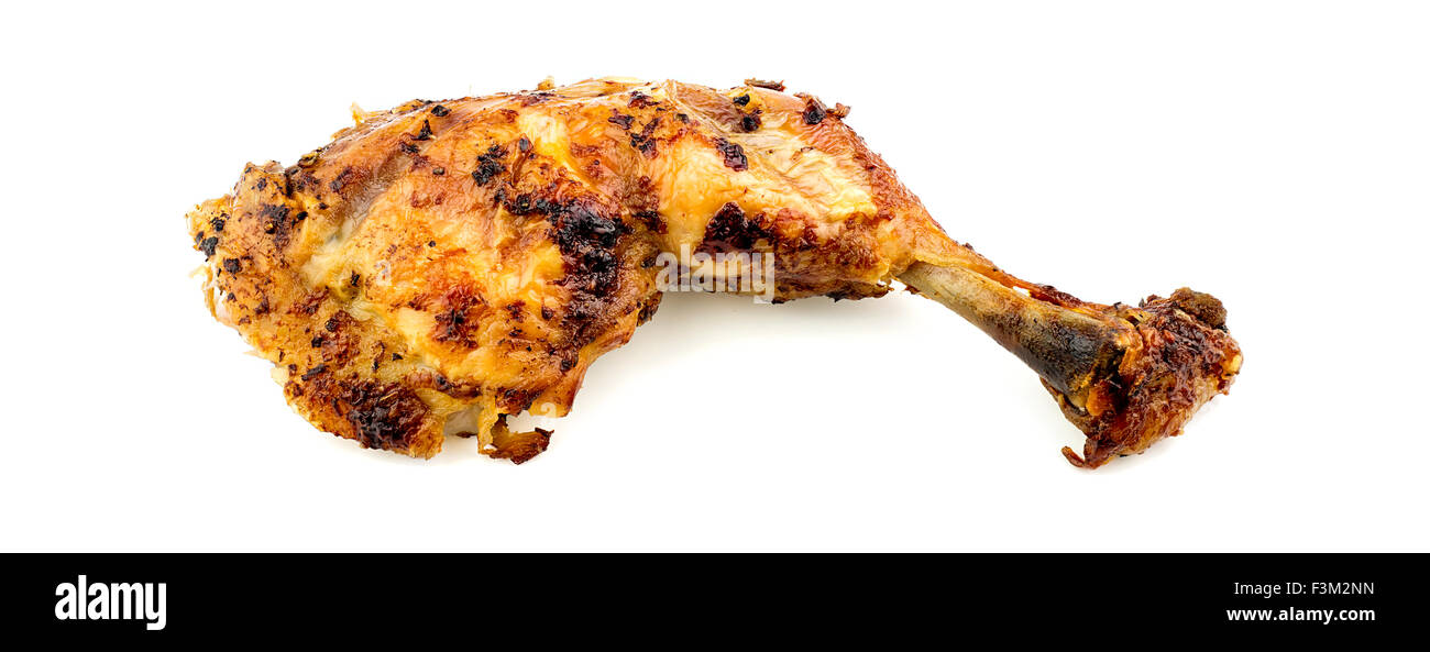 Organic farm fed roasted chicken leg drumstick Stock Photo
