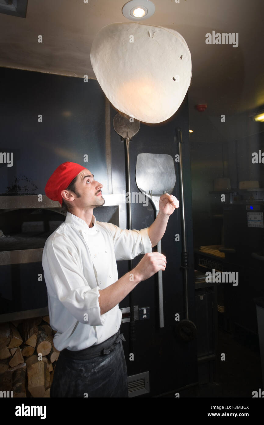 Pizza dough throwing, Strada, Italian chain restaurant, Covent Garden, London, England, UK Stock