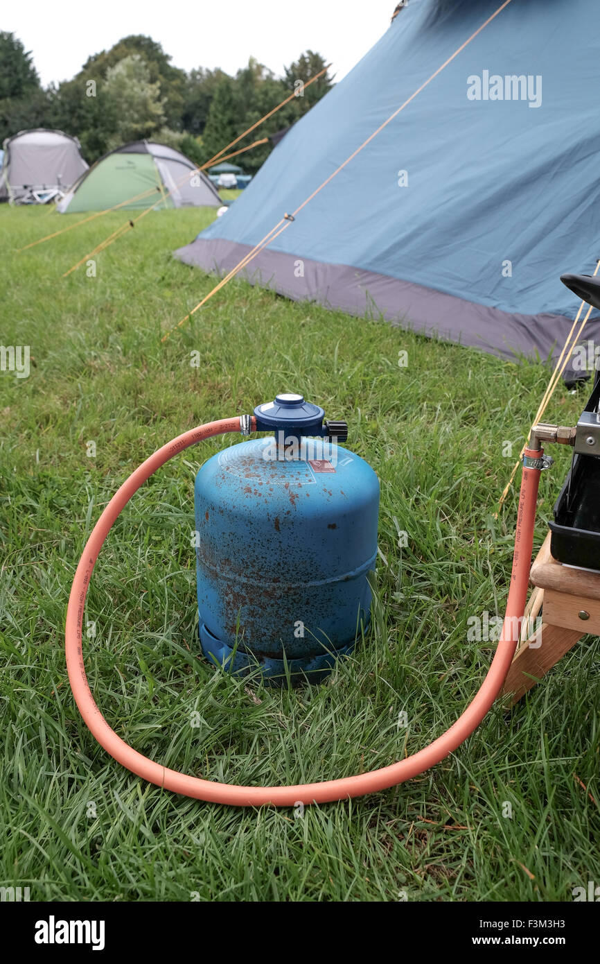 Gas bottle being used whilst camping for stove Stock Photo Alamy