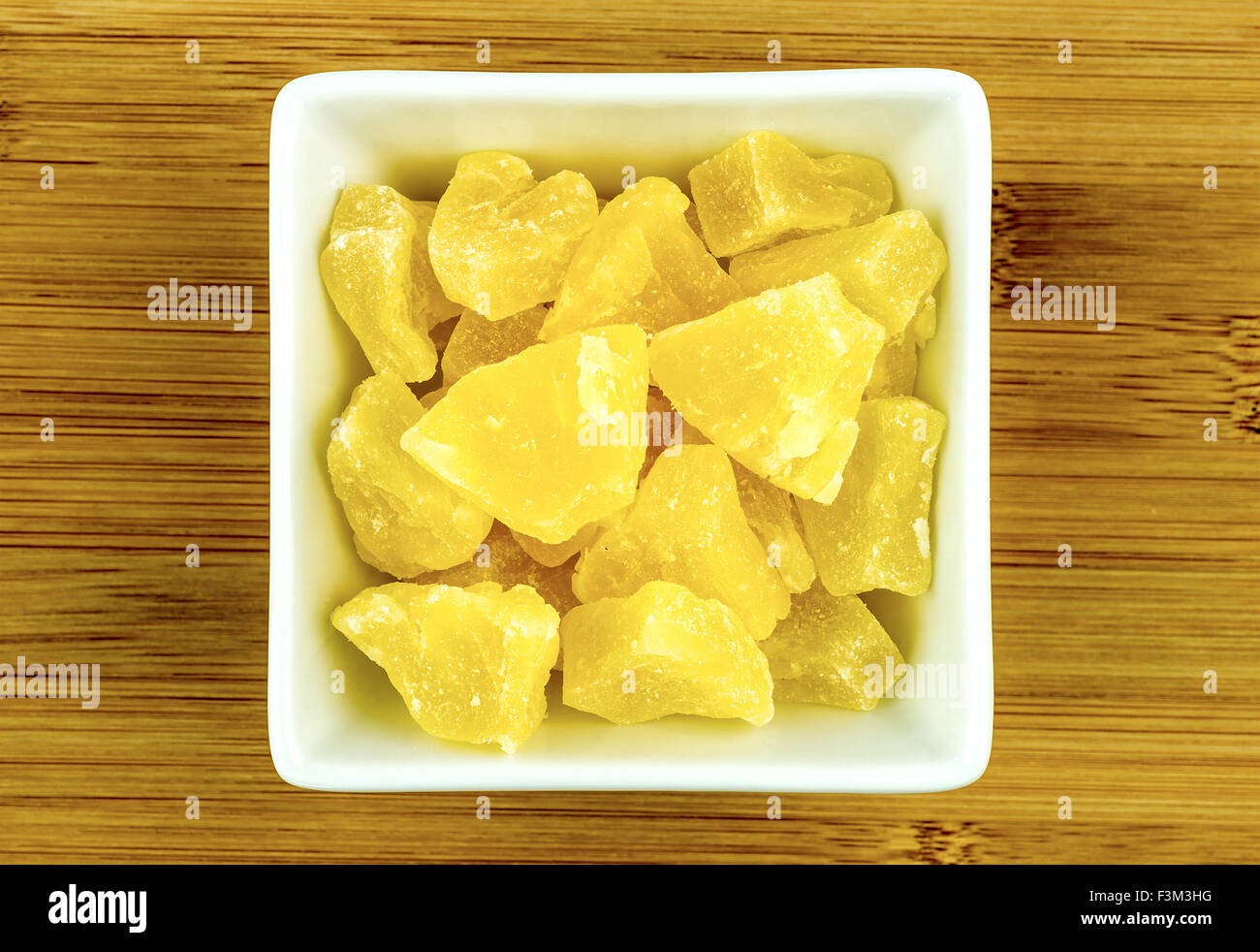 Dried candied pineapple in bowl Stock Photo Alamy