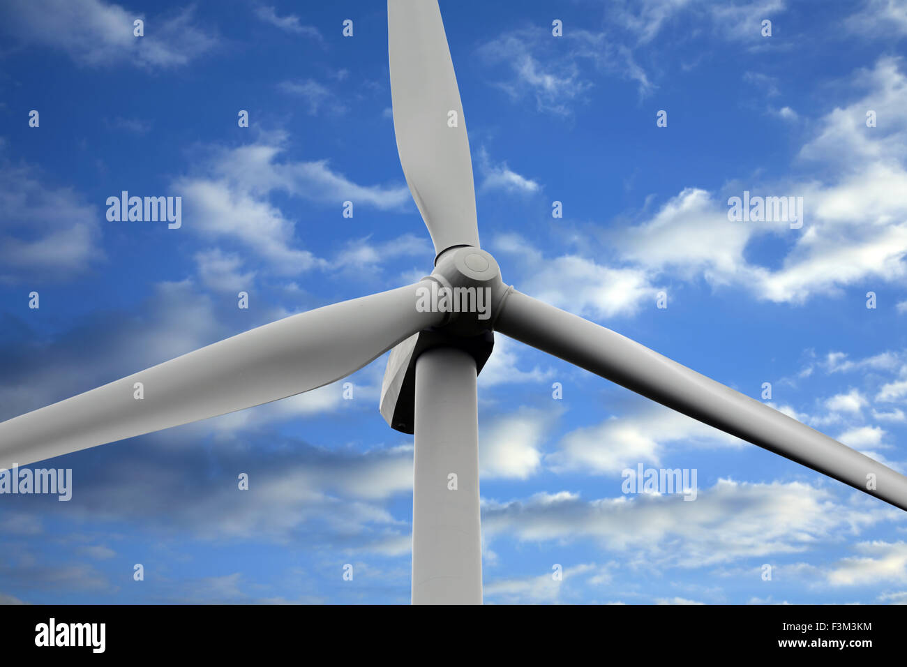 Close up of wind turbine against blue sky and clouds Stock Photo - Alamy
