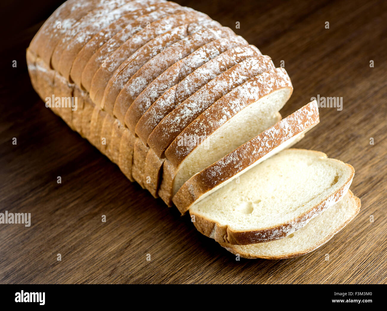 Freshly baked bread against rustic backdrop Stock Photo
