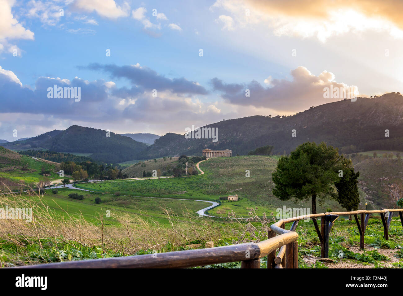 Landscape and doric temple at sunset in Segesta archaeological area, Sicily Stock Photo