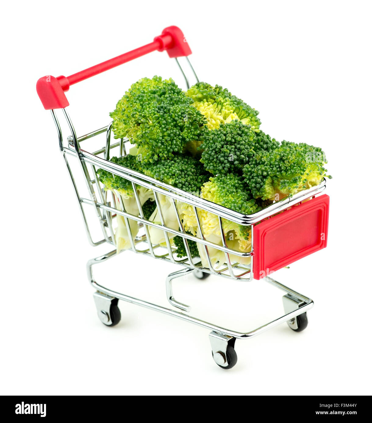 Giant broccoli bunches in market shopping store cart isolated on white background Stock Photo