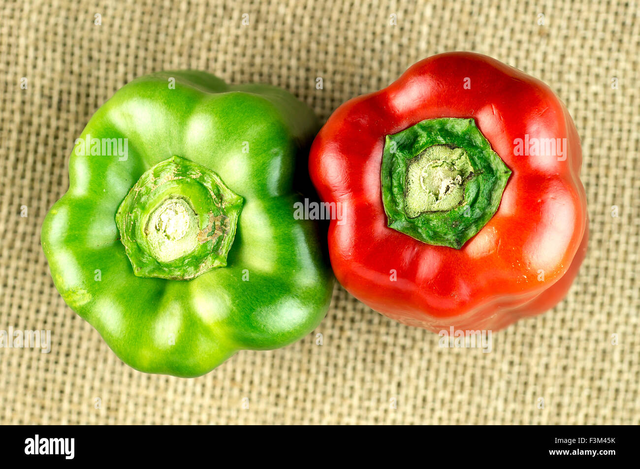 Aerial of red and green bell peppers on hessian Stock Photo - Alamy