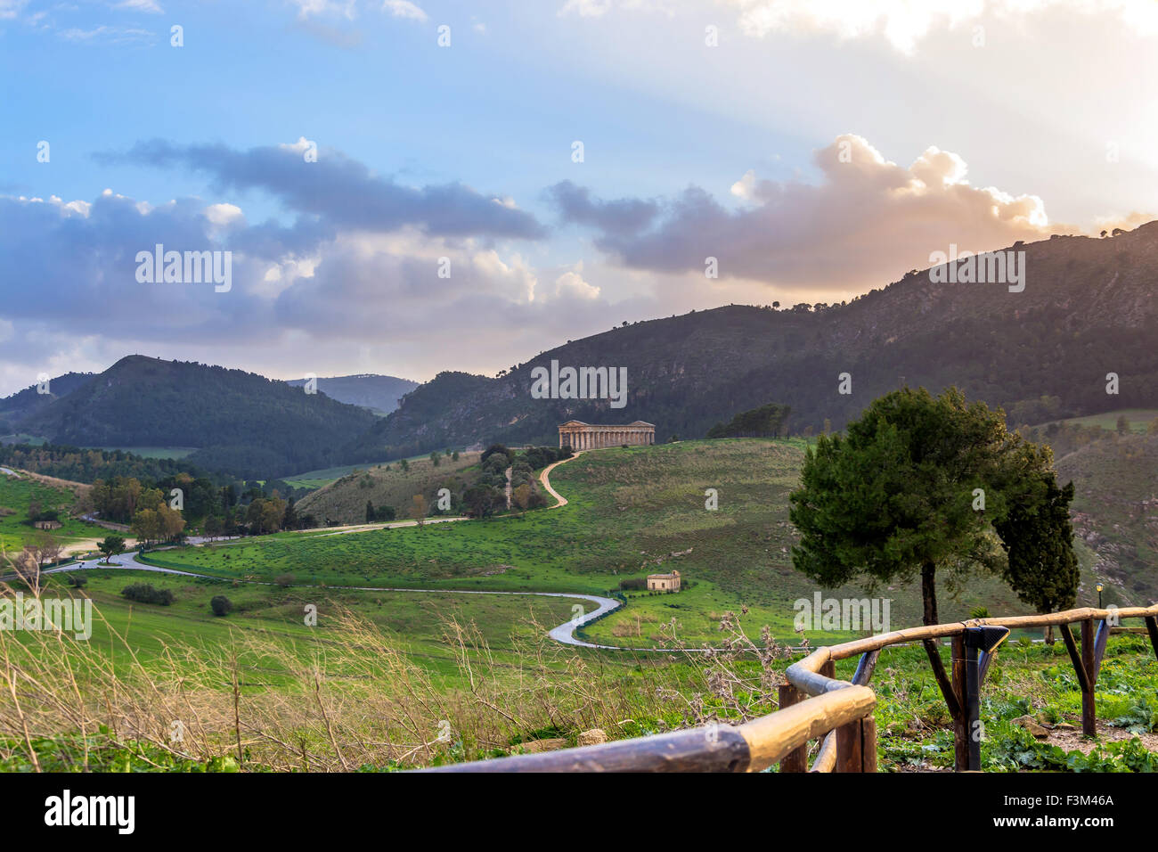 Landscape and doric temple at sunset in Segesta archaeological area, Sicily Stock Photo