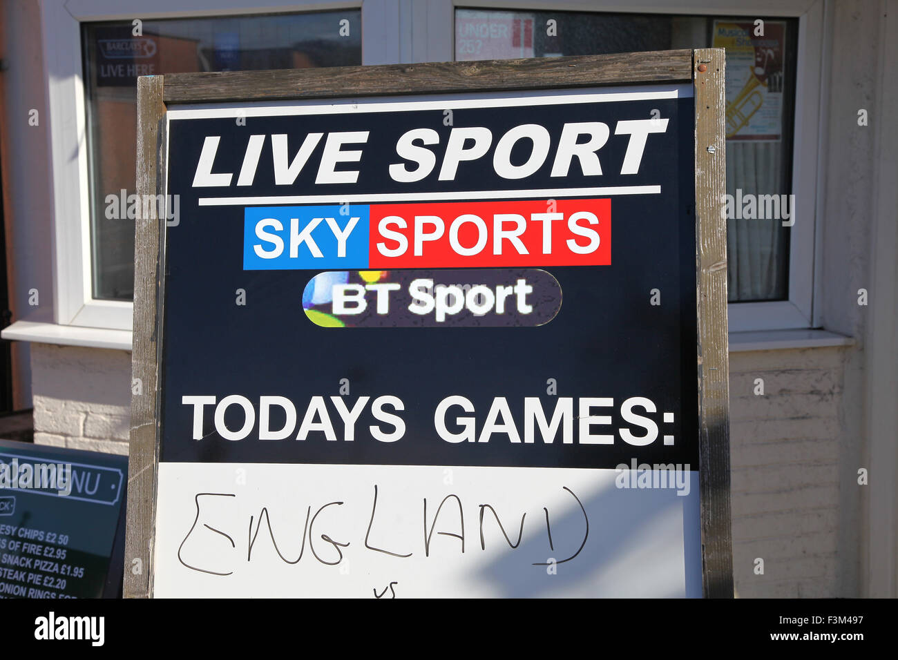 A sign on a pub or public house saying bt sport and sky sports live sport shown here England versus Stock Photo
