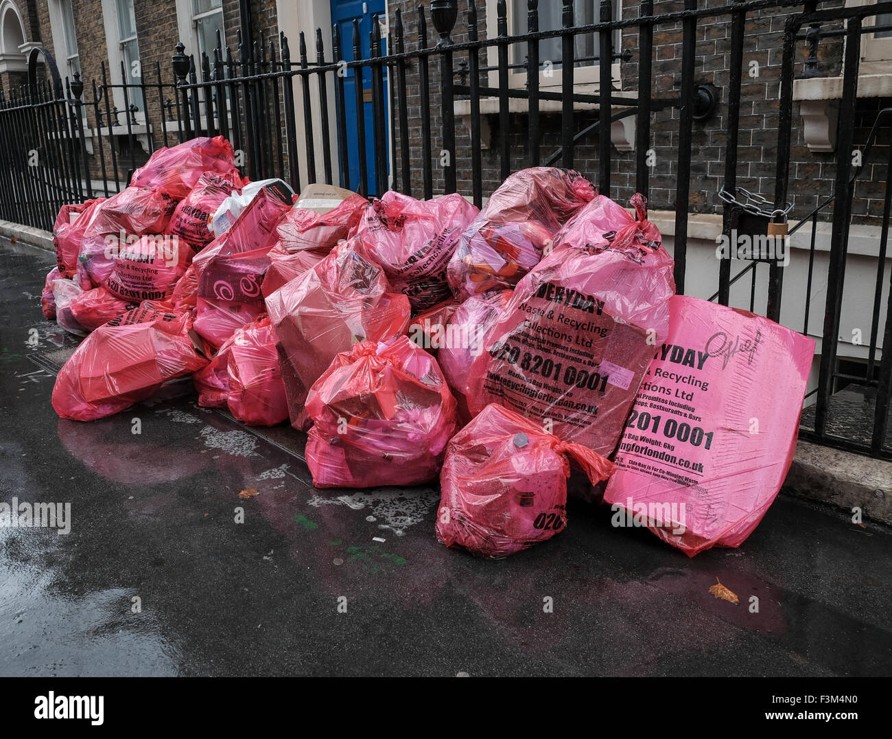 Recycle rubbish on the streets of London in pink bags Stock Photo - Alamy