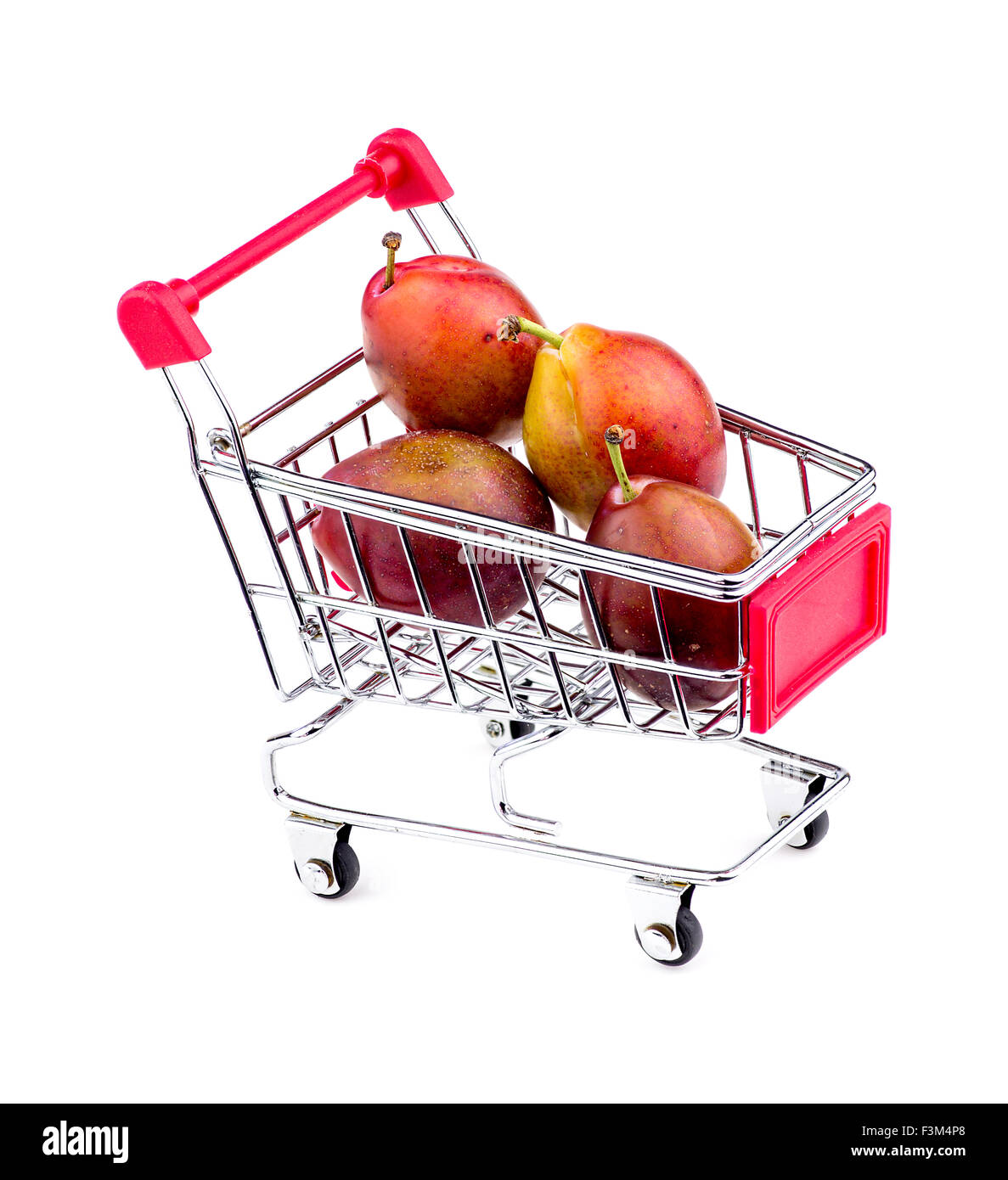 Gigantic sugar plums in shopping cart Stock Photo