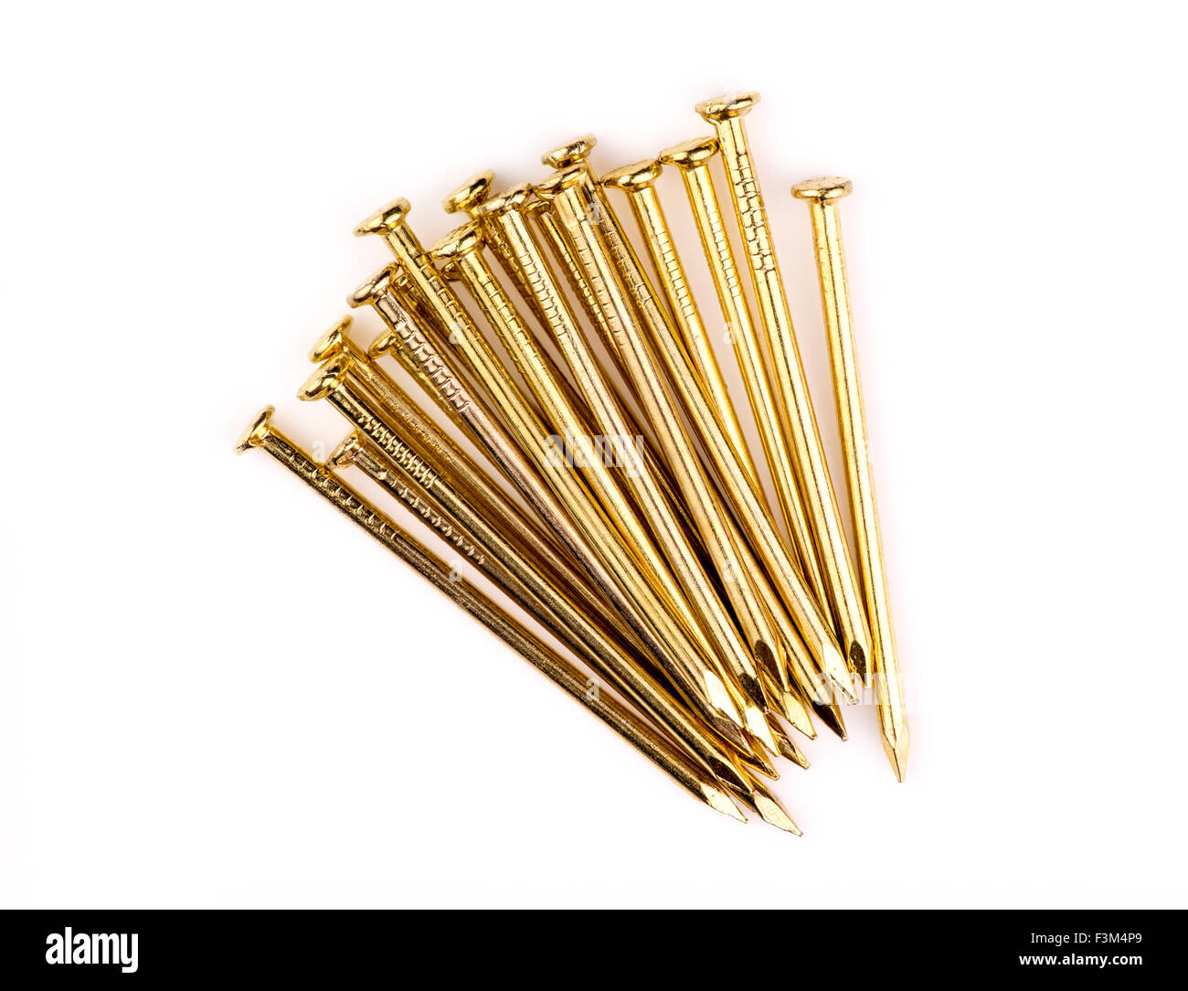 Pile of sharp brass nails Stock Photo
