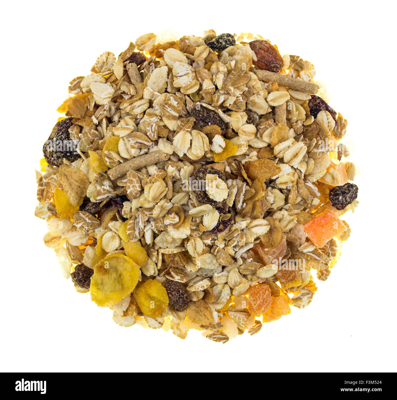 Mixed muesli in a circle shaped pile isolated against a white backgound Stock Photo