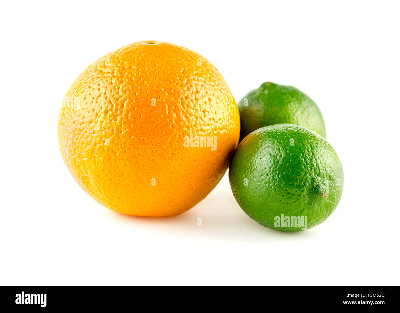 Orange and limes in colorful fruit medley Stock Photo - Alamy