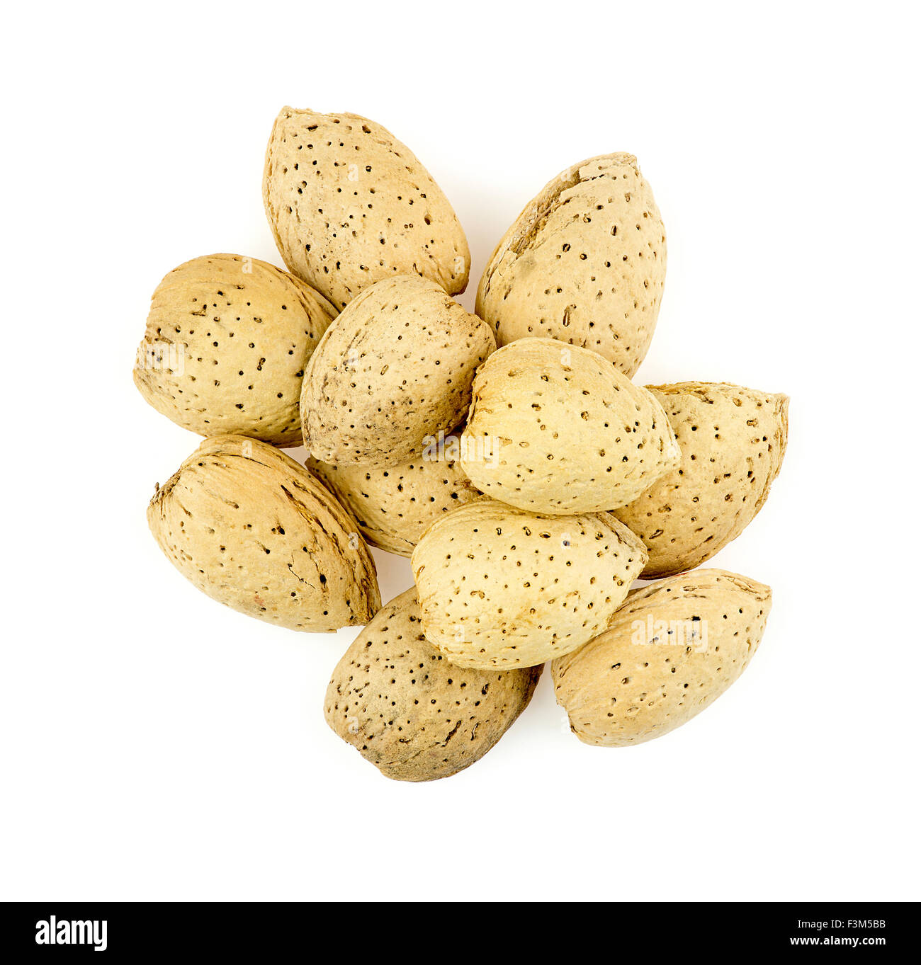 Pile of natural unshelled almonds on white Stock Photo